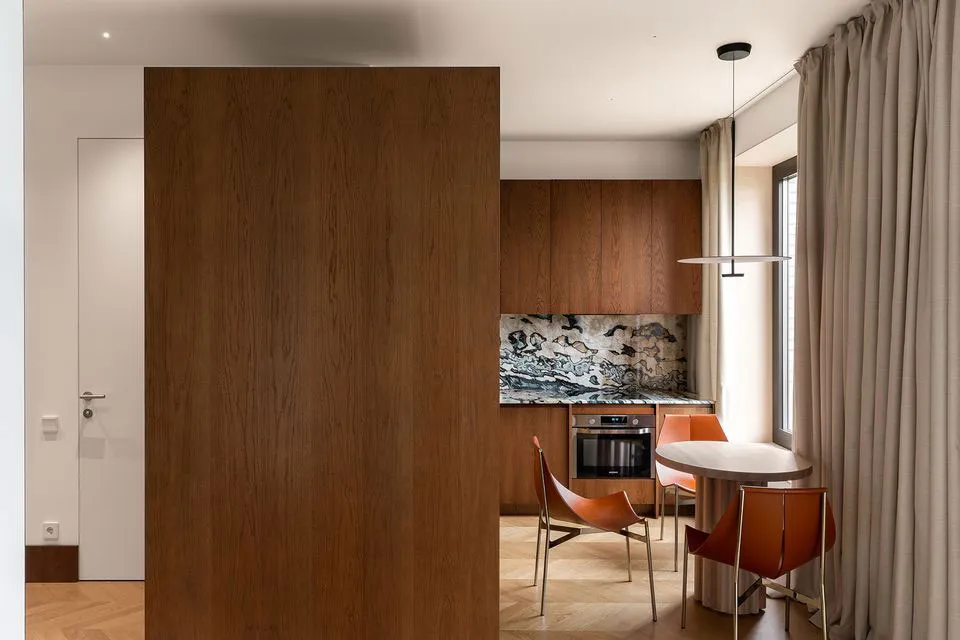 Modern kitchen with wooden accents and marble countertop