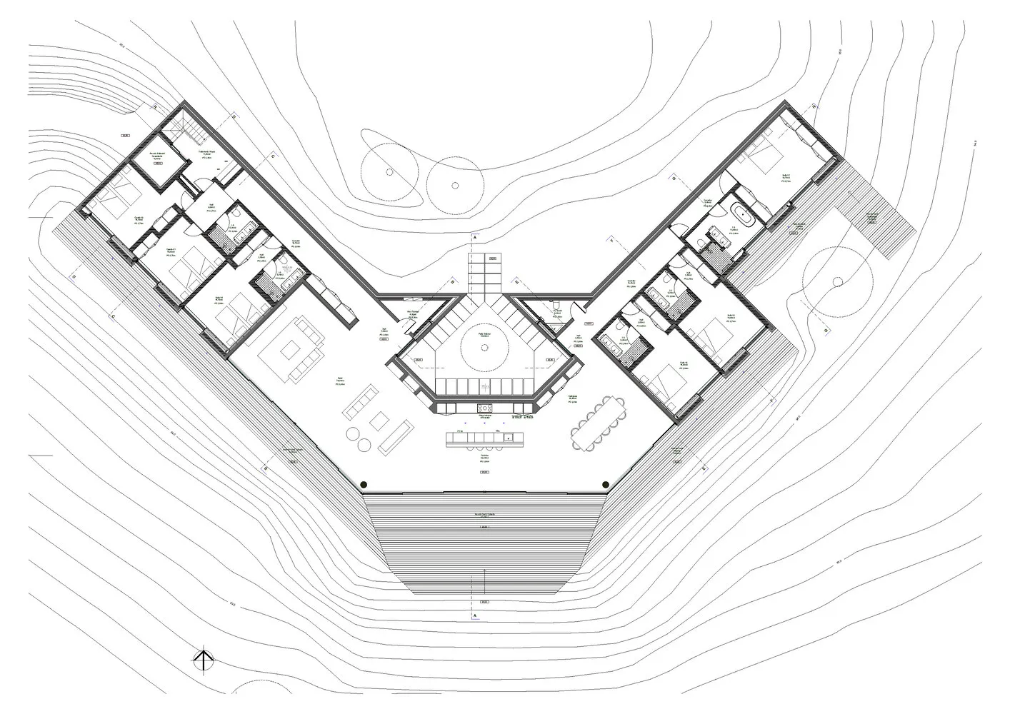 Floor plan of a modern residential building with multiple rooms and outdoor areas.