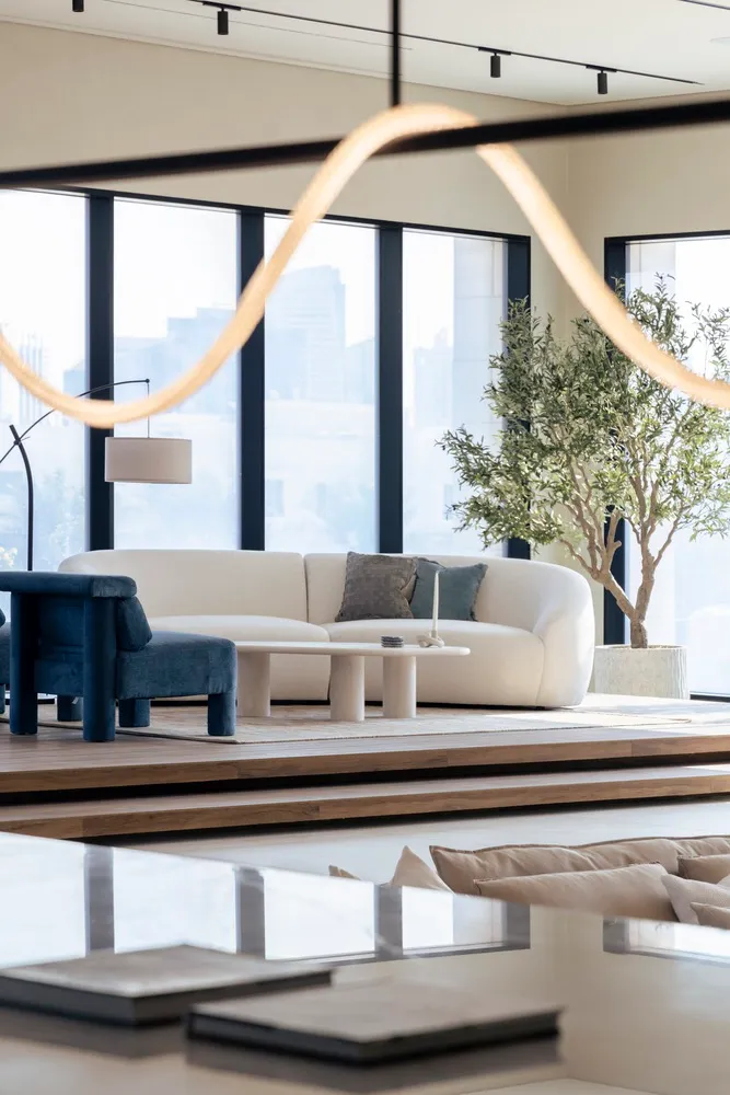 Modern minimalist living room with textured cotton sofa and coffee table.