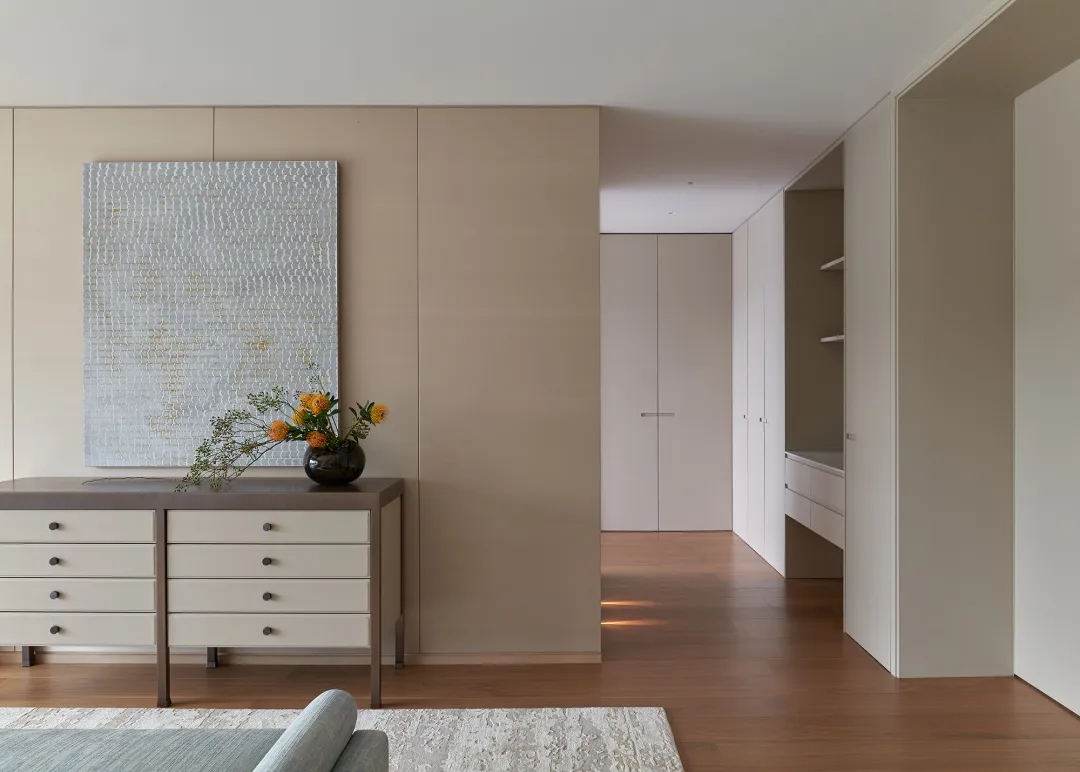 Modern entryway with neutral-toned materials and minimalist design.