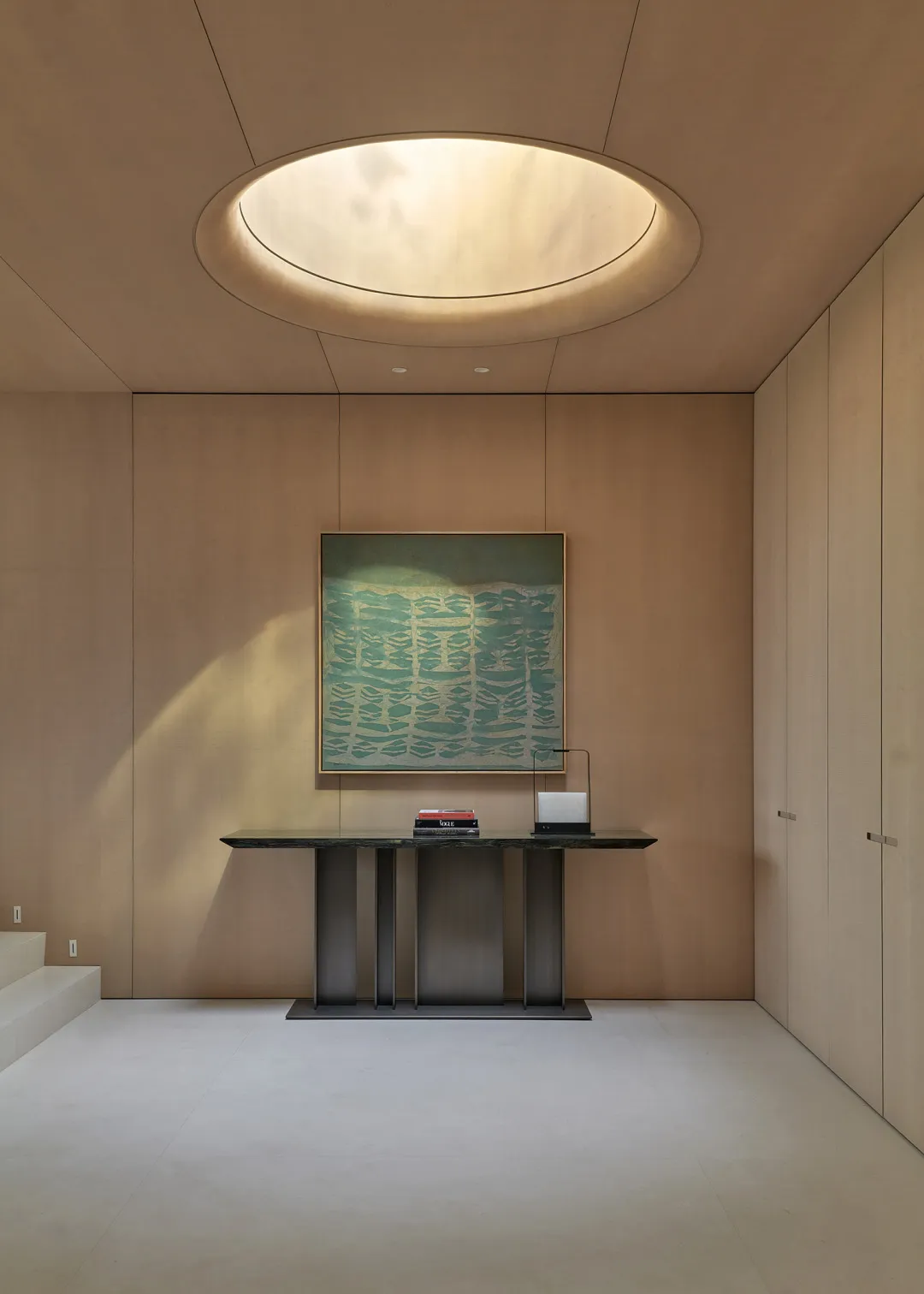 A minimalist interior design featuring a marble console table.