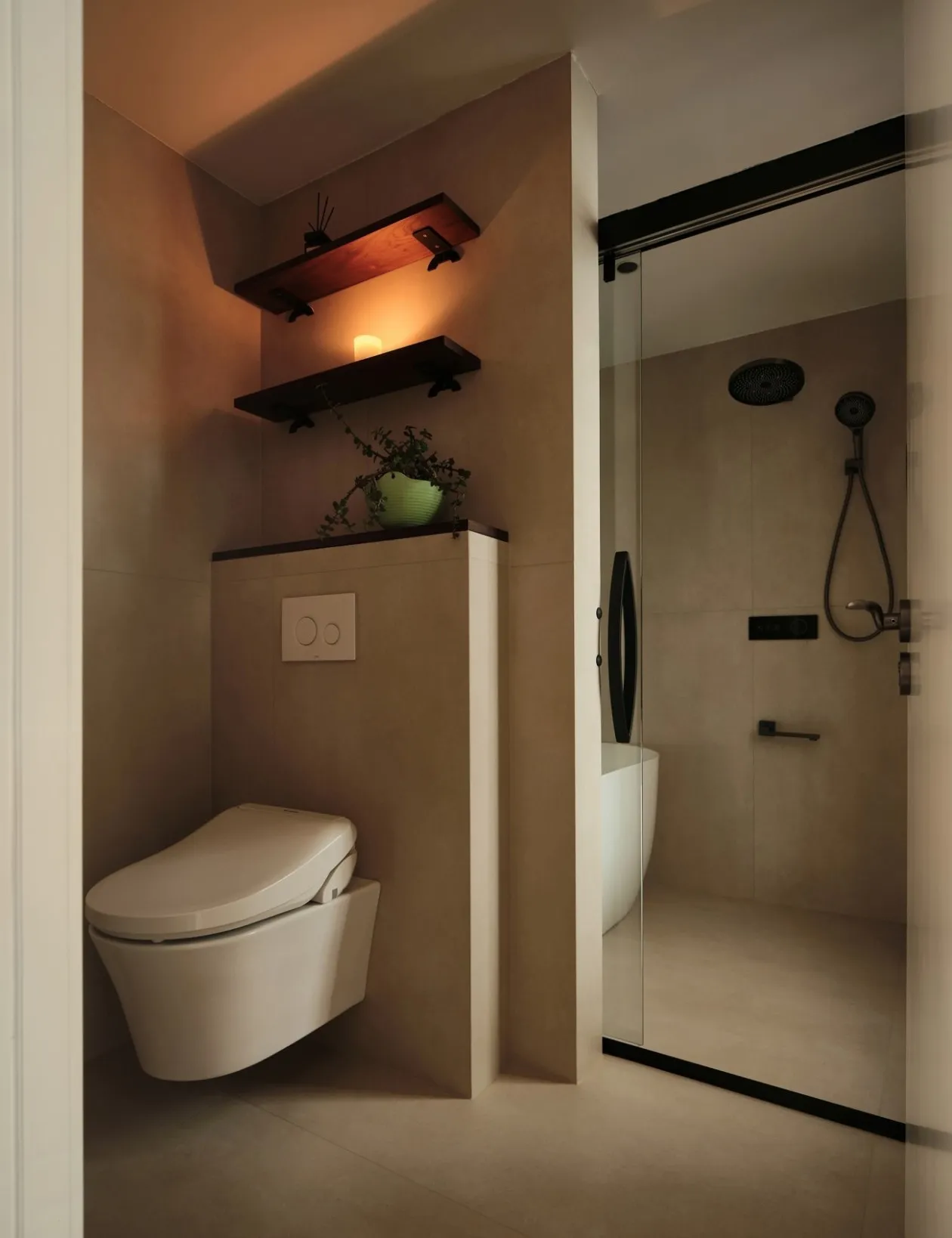 Minimalist bathroom featuring ceramic tiles, sleek design, and modern fixtures.
