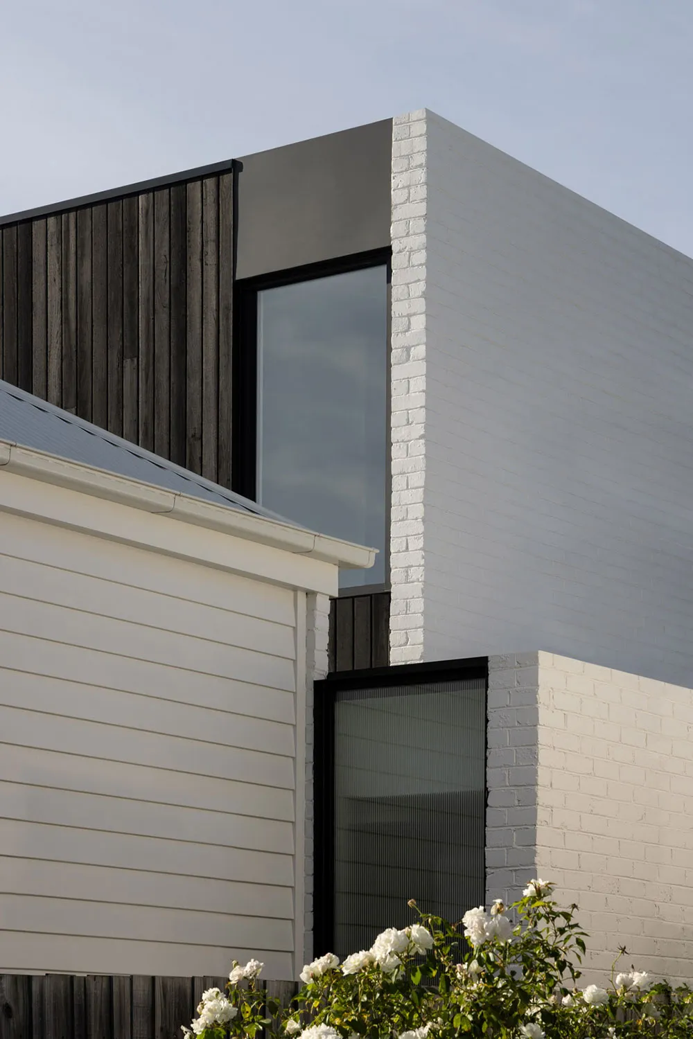 A modern architectural structure featuring brick materials.