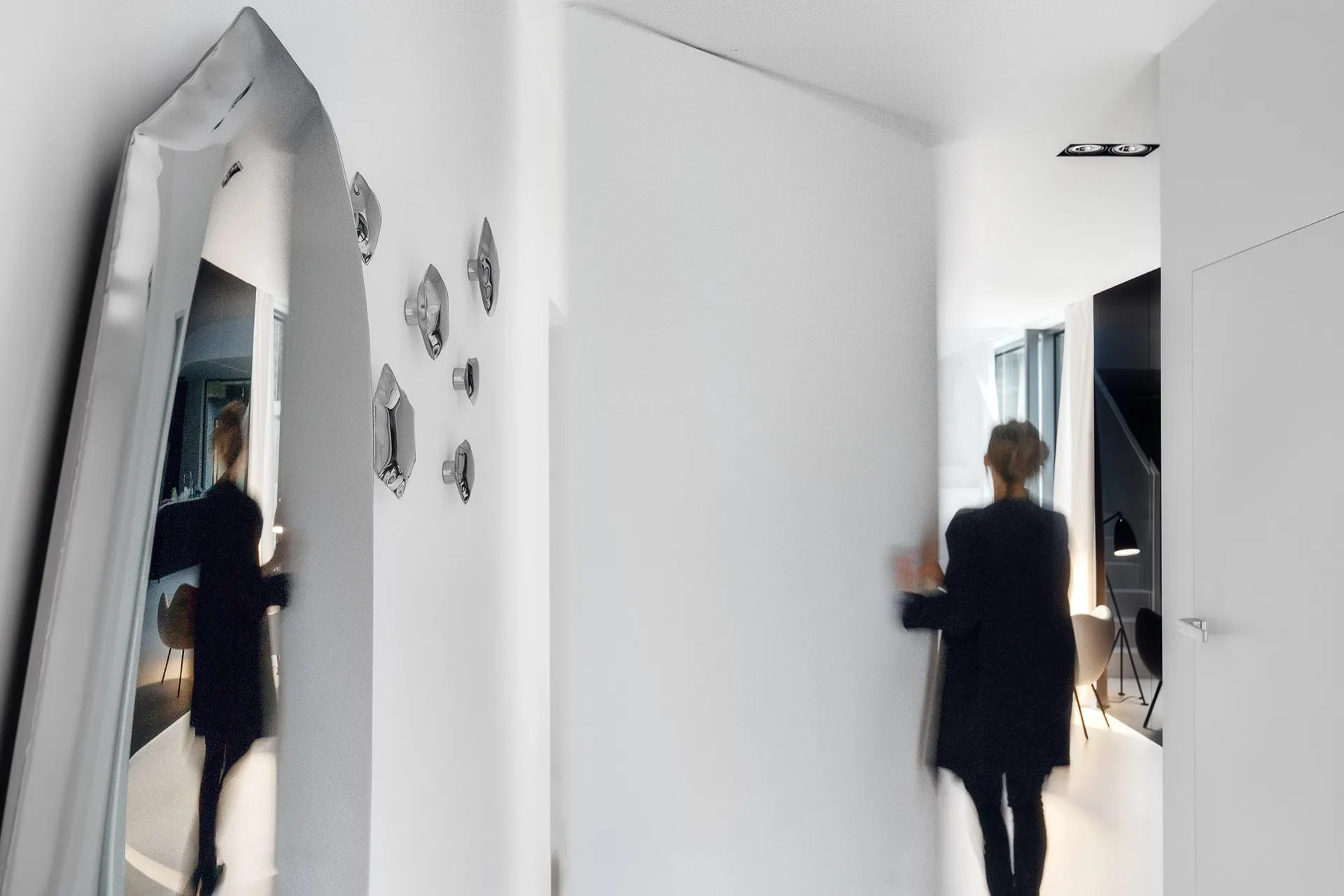 A minimalist apartment with white walls.