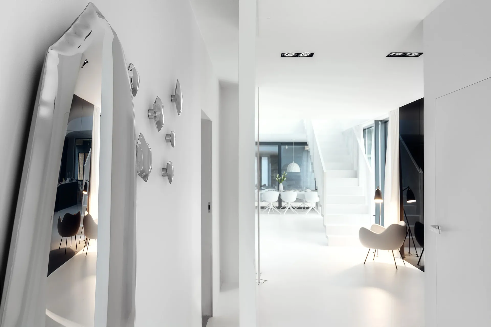 A modern minimalist white interior design with clean lines and a monochromatic color scheme.