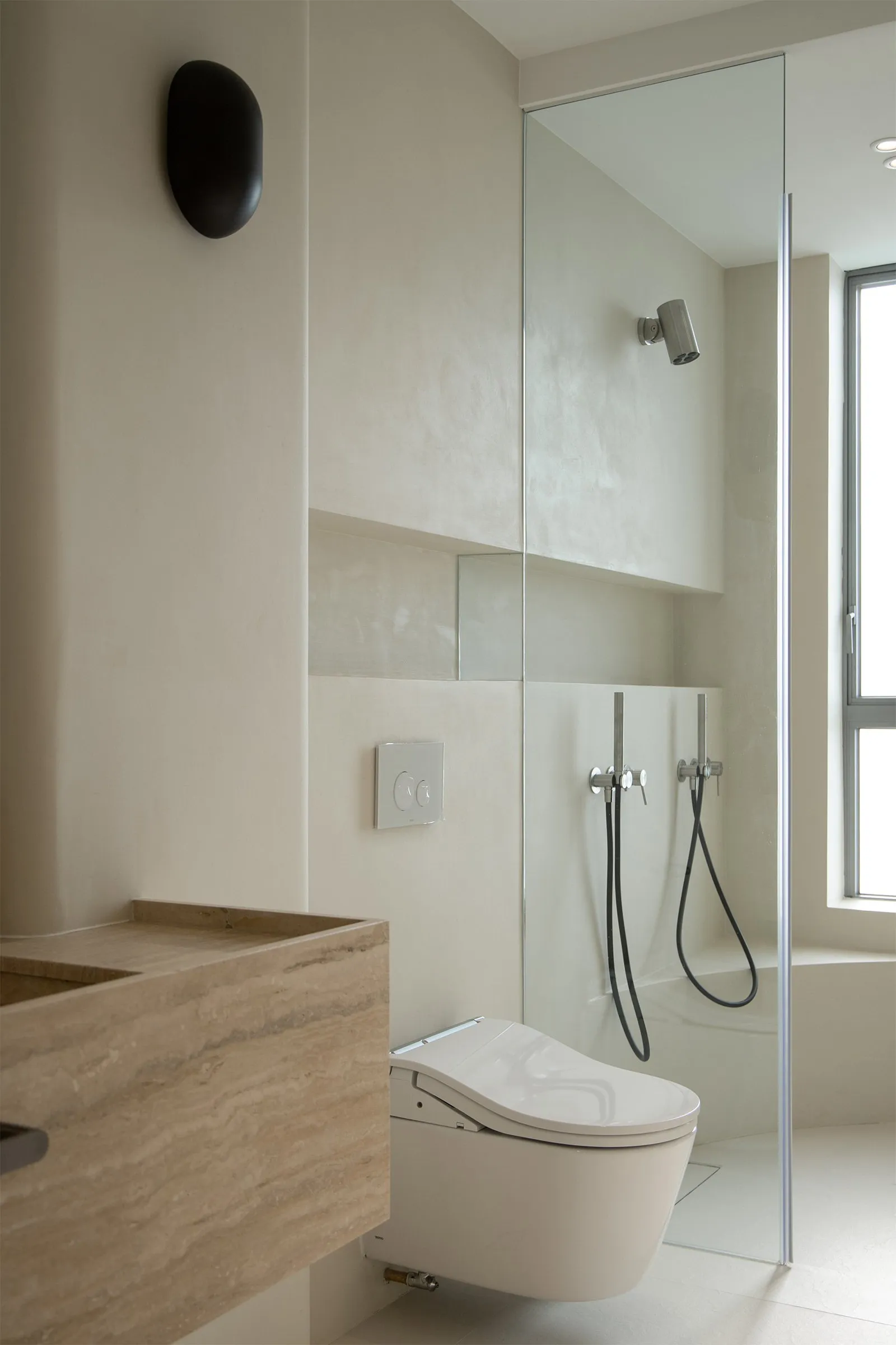 Modern bathroom featuring ceramic and glass elements