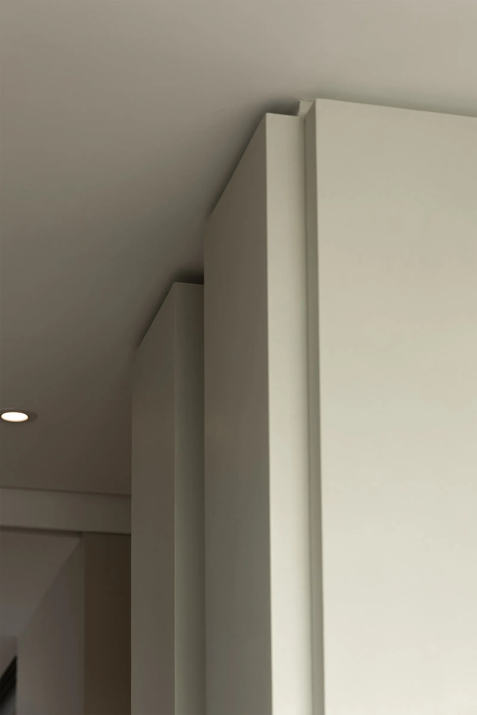 Modern architectural design featuring minimalist white walls and ceiling angles