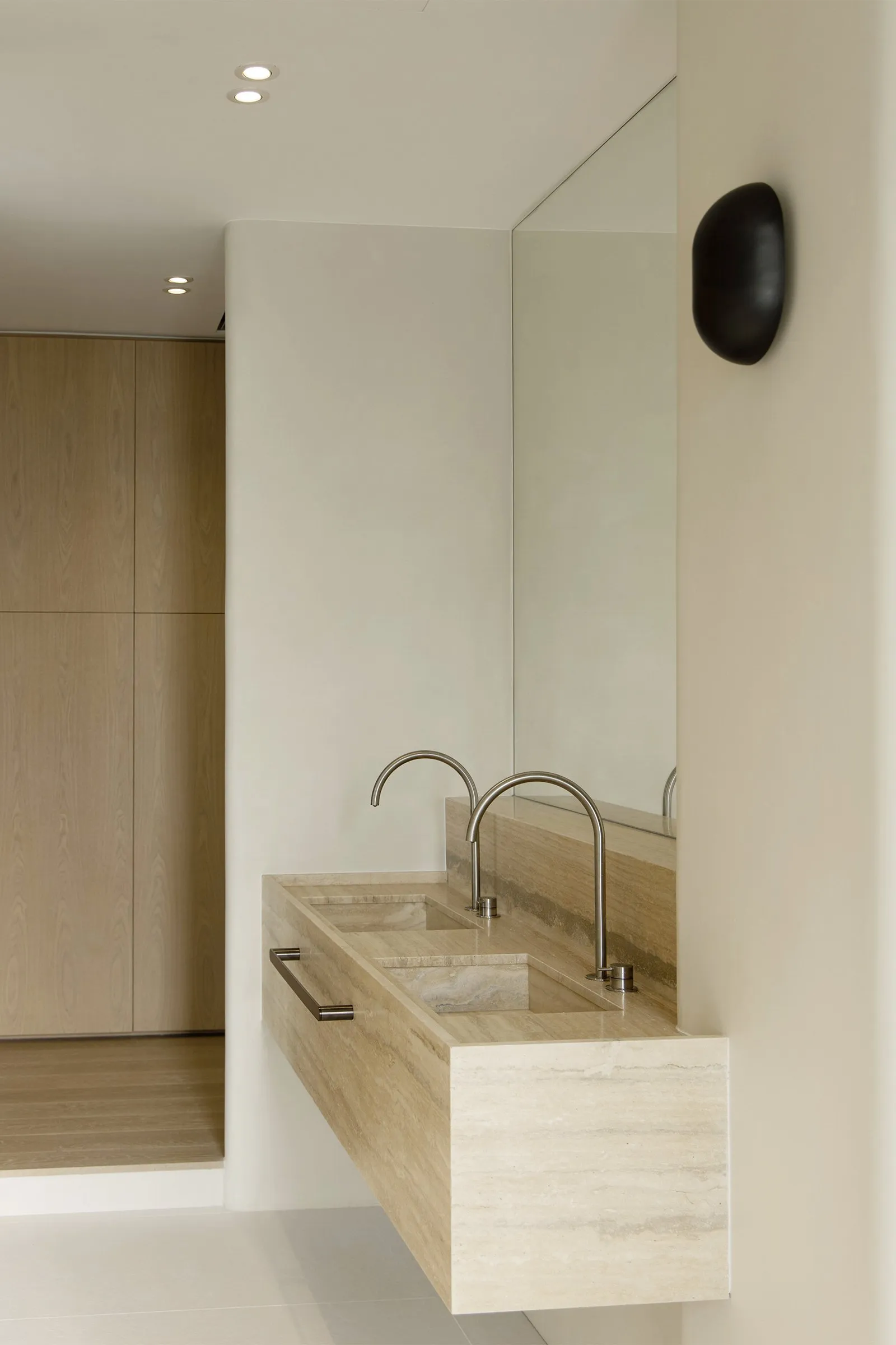 Modern bathroom with minimalist design featuring marble elements.