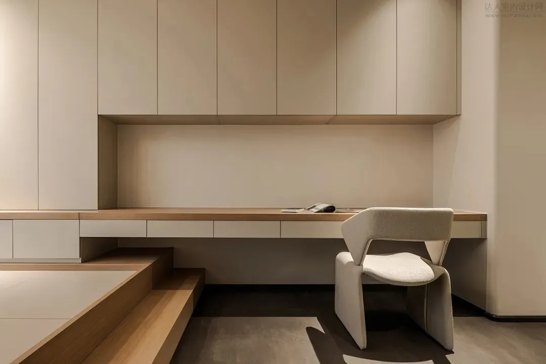 A modern office workspace featuring wooden furniture and a minimalist design.