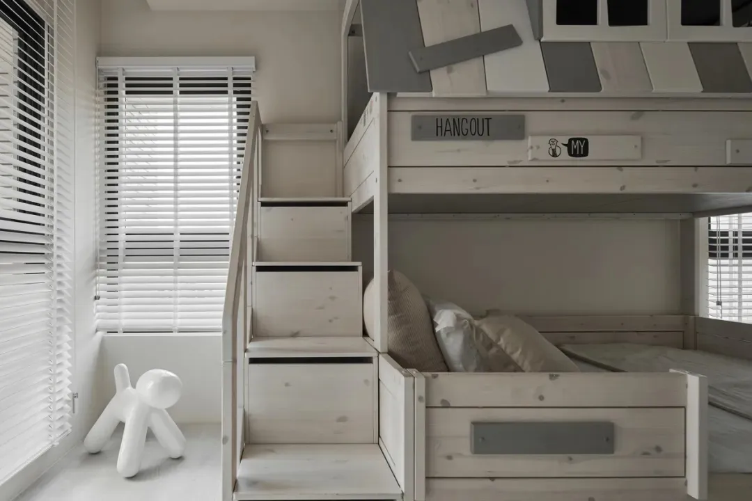 Modern bunk bed with wooden frame and built-in stairs