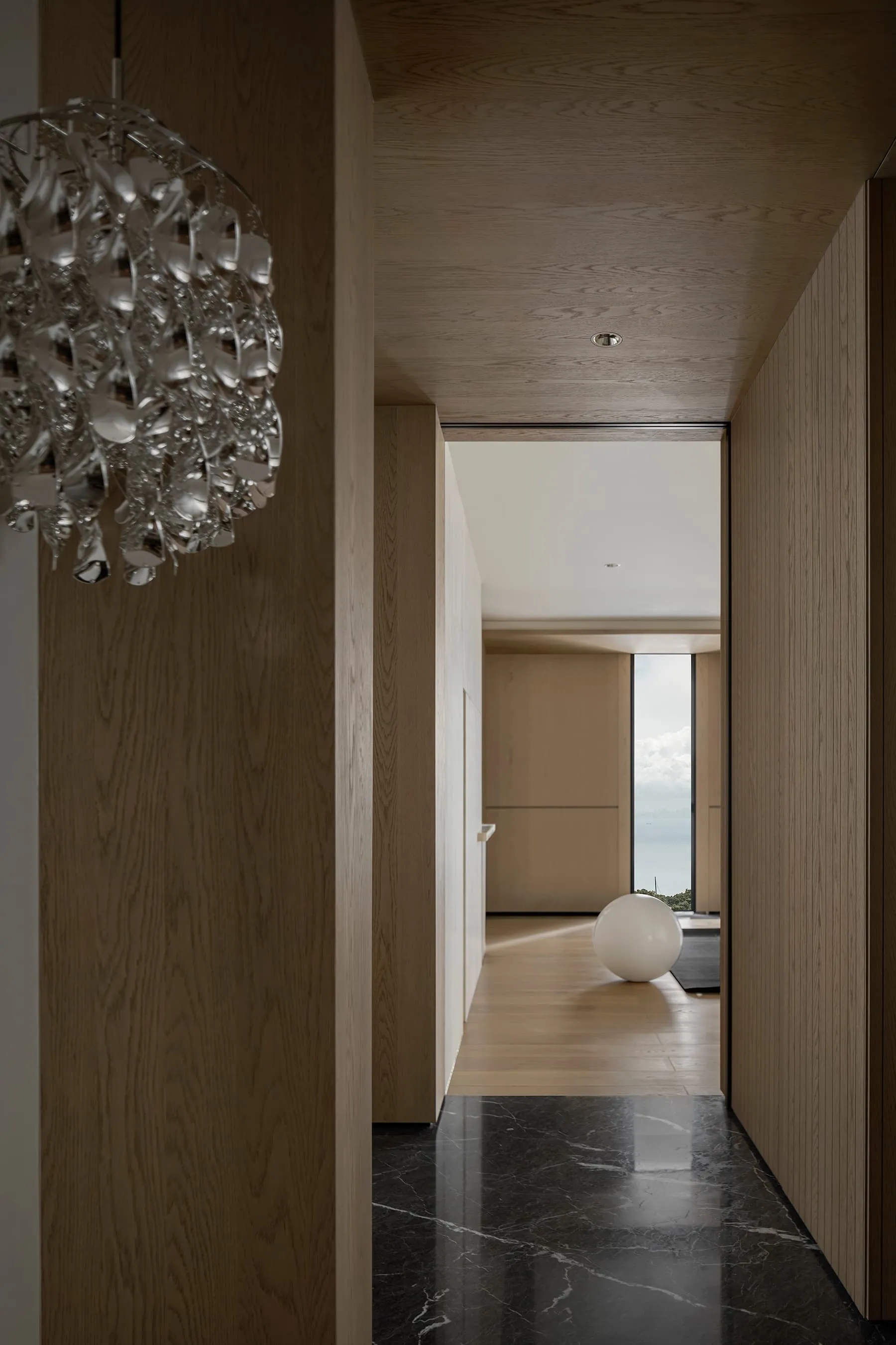 A modern minimalist hallway with polished wooden walls and a black marble floor. A modern chandelier hangs from the ceiling,