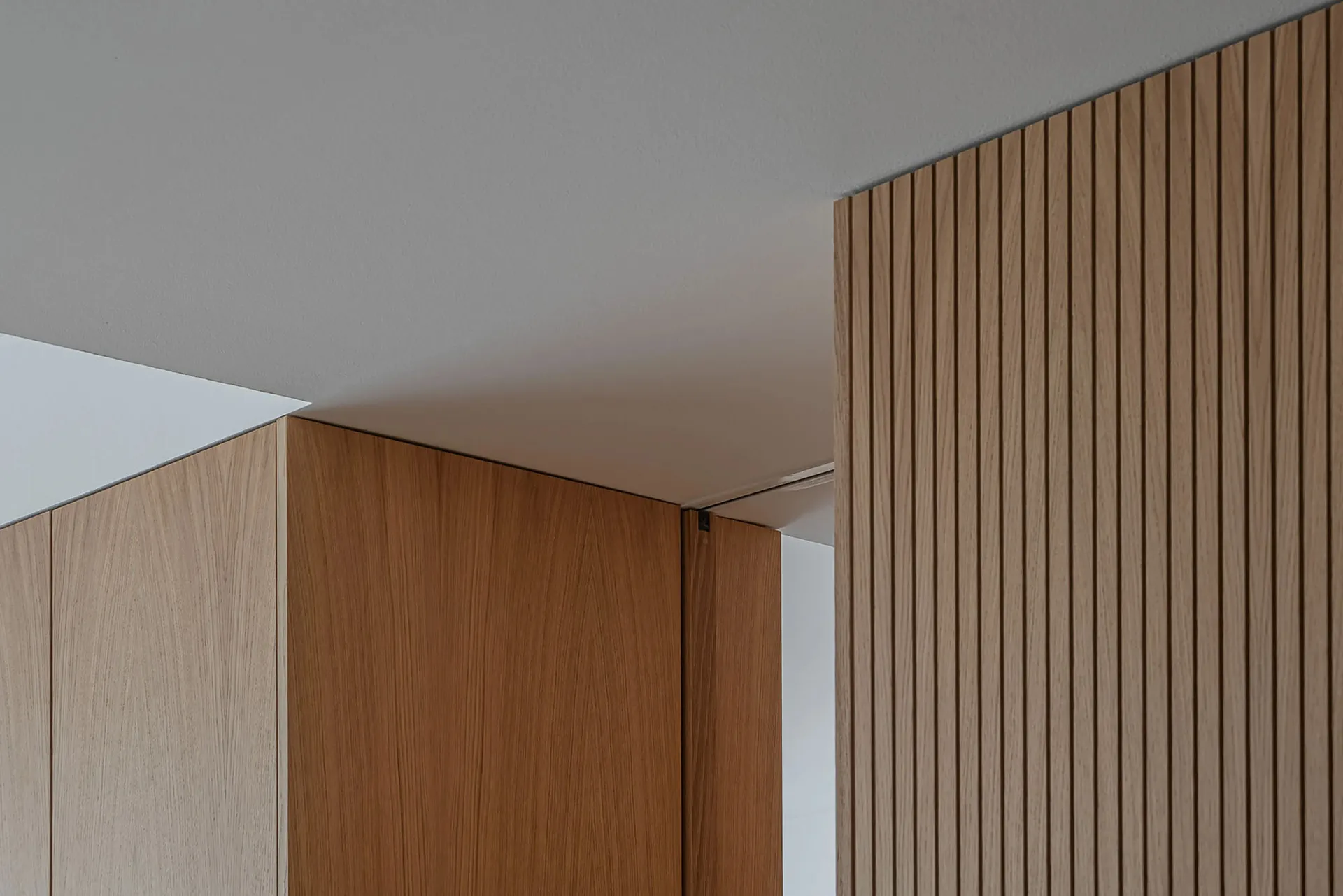 Modern architecture interior with wooden panels and minimalist design.
