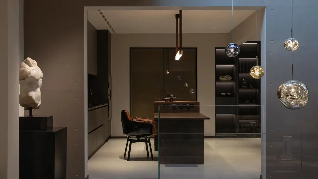 Modern kitchen with metallic finishes, featuring sleek design elements and contemporary fixtures.