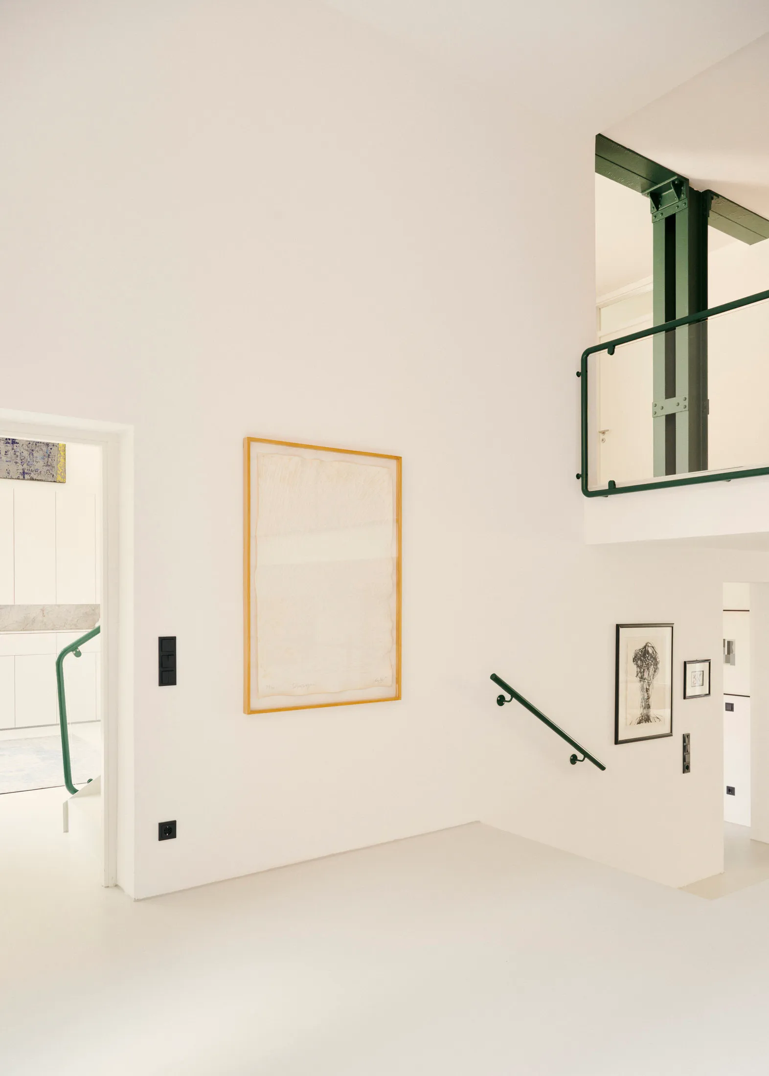 Modern minimalist interior space with art in gold frame