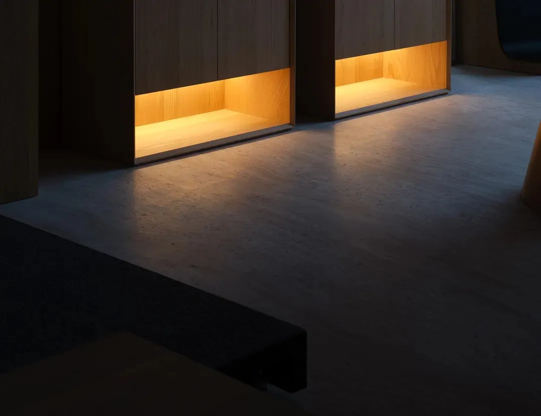 Floating wooden office desk with warm lighting.