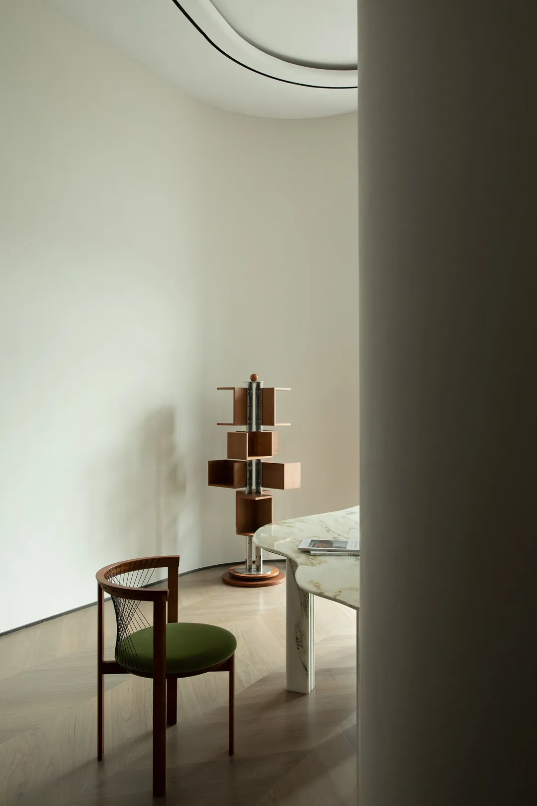 A modern interior design featuring wooden furniture and metallic accents.