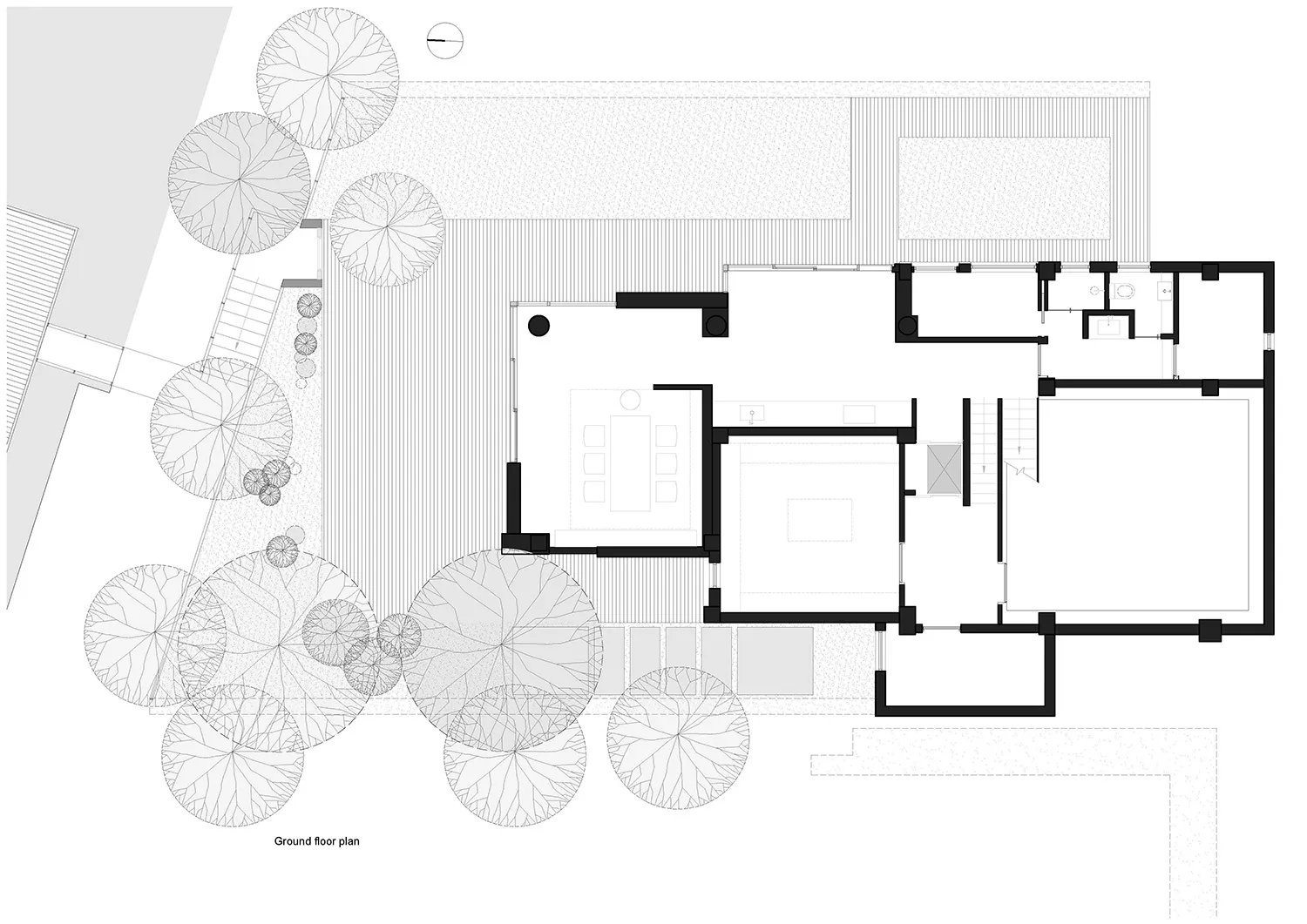 Modern residential house with a ground floor plan featuring open living space, bedrooms, bathrooms, and outdoor deck.
