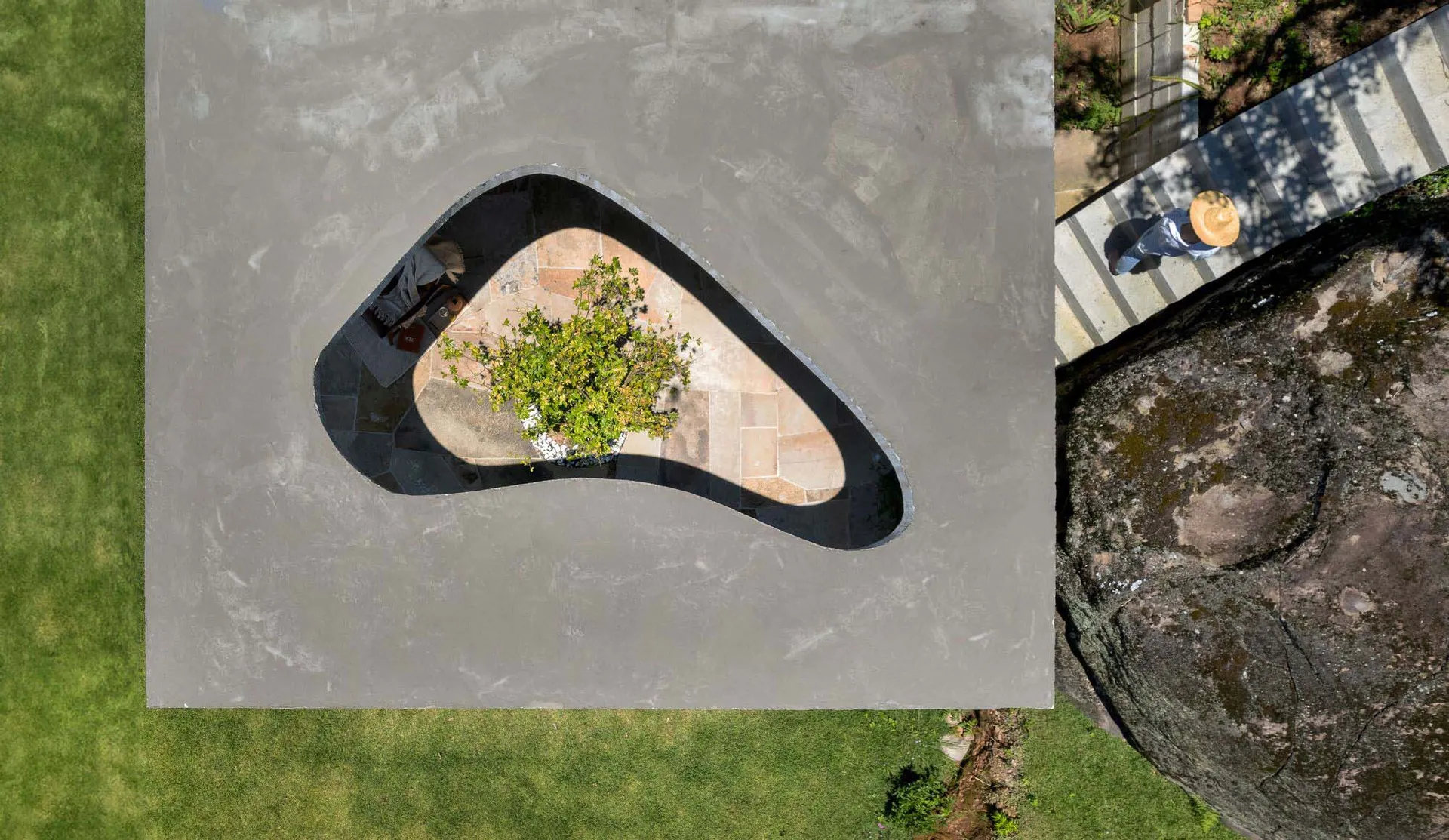 An overhead view of a modern architectural concrete pavilion design.