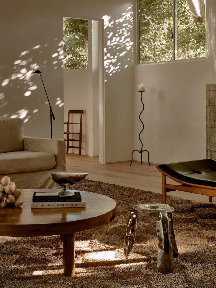 A modern living room with minimalist furniture, wood floors, and a sleek, contemporary design.