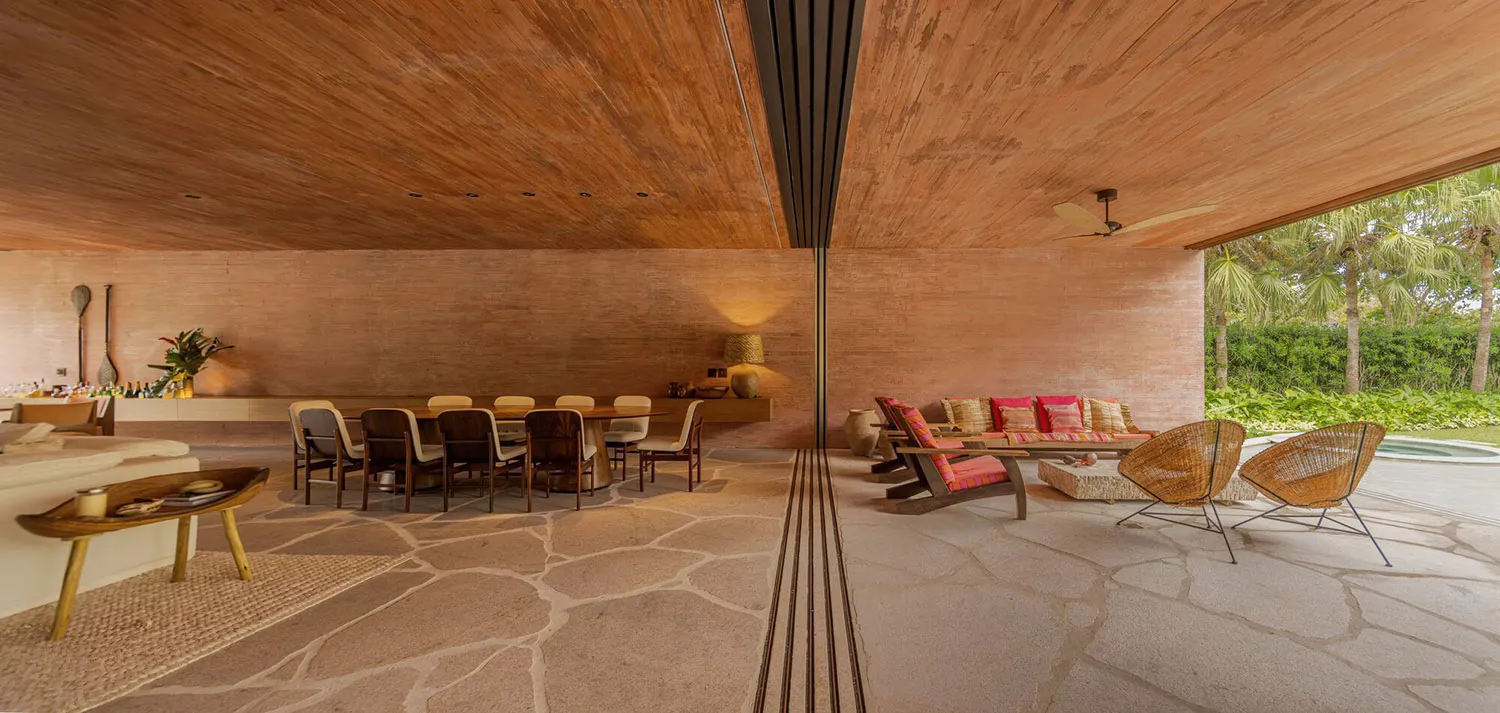 A modern, spacious living room with a unique terrazzo floor and comfortable seating arrangements.