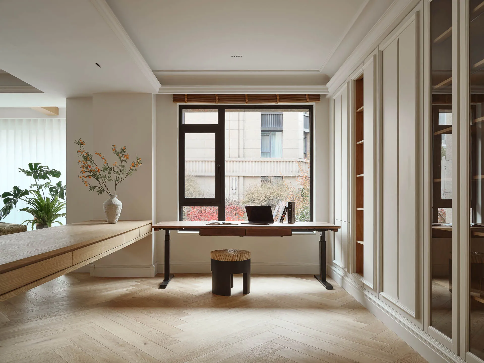 A minimalist office space featuring wooden and marble elements.