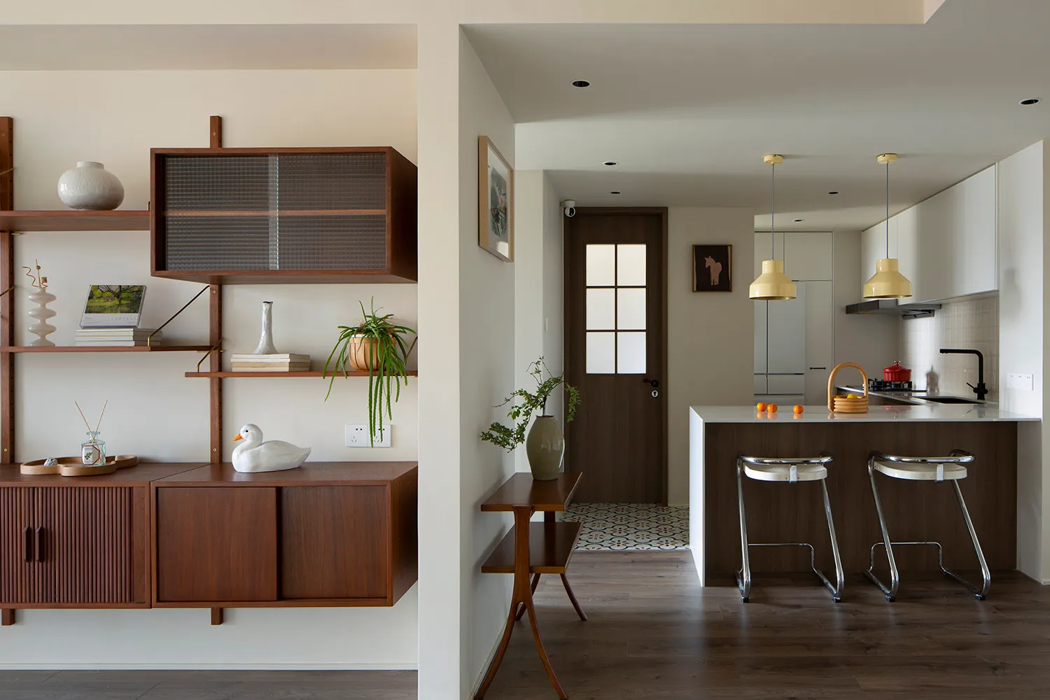 A modern kitchen with minimalist design and wooden features.