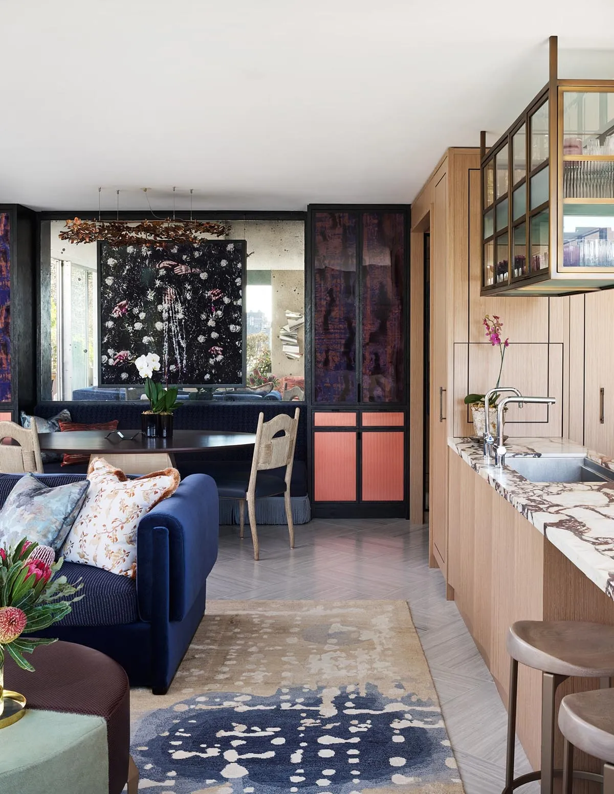 A modern interior design featuring a mix of materials such as wood, marble, and metal.