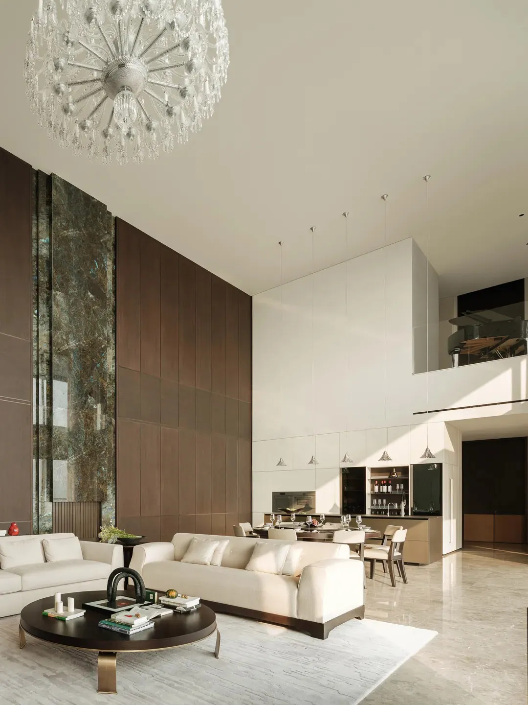 Modern living room and dining area with marble accents and wooden elements