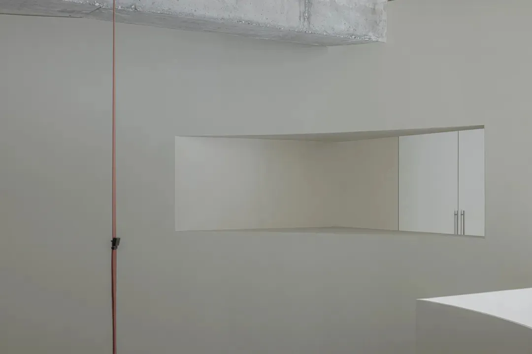 Minimalist office space featuring concrete and metal materials