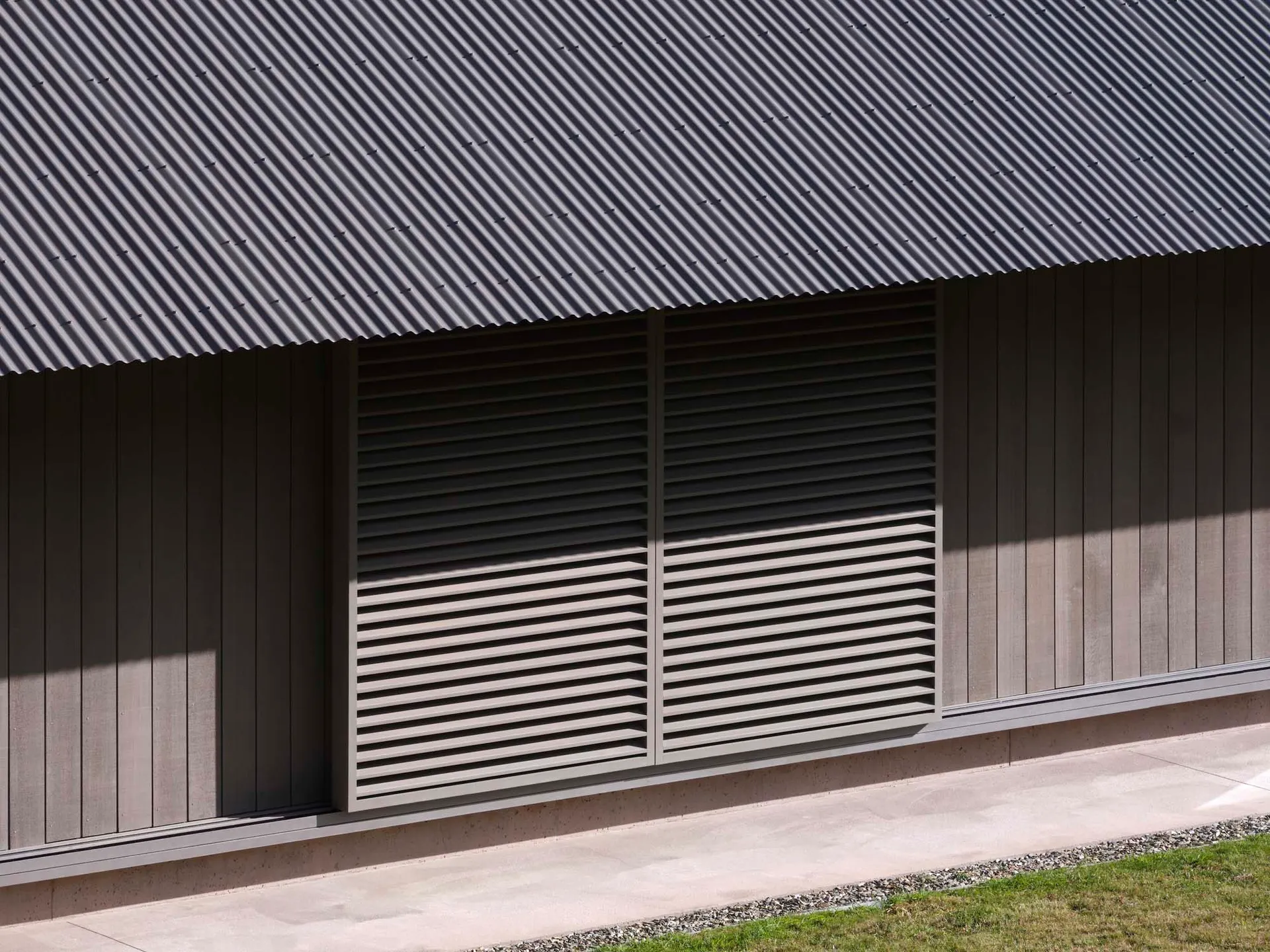 A minimalist garage door with a metal exterior.
