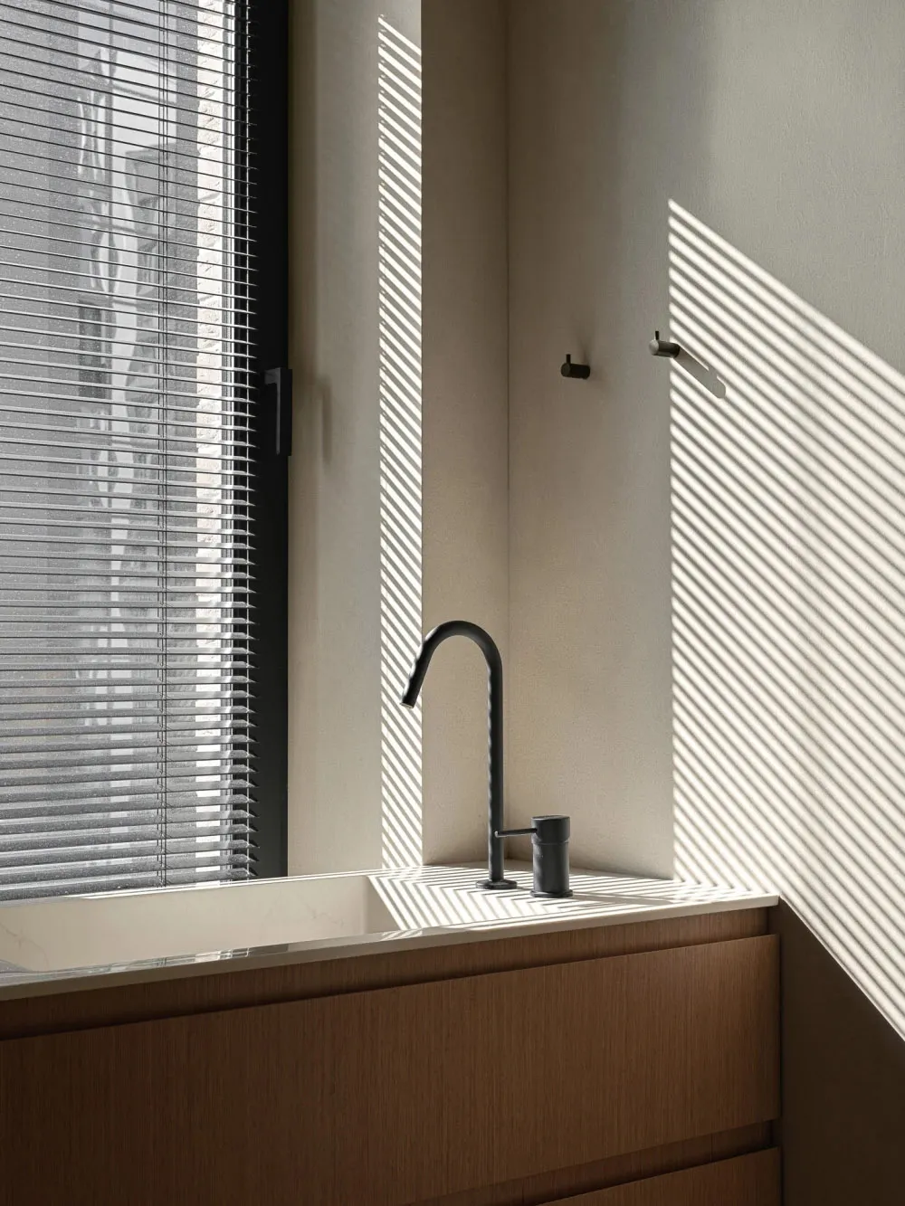 Modern bathroom with concrete sink, wooden countertop, and minimalist design