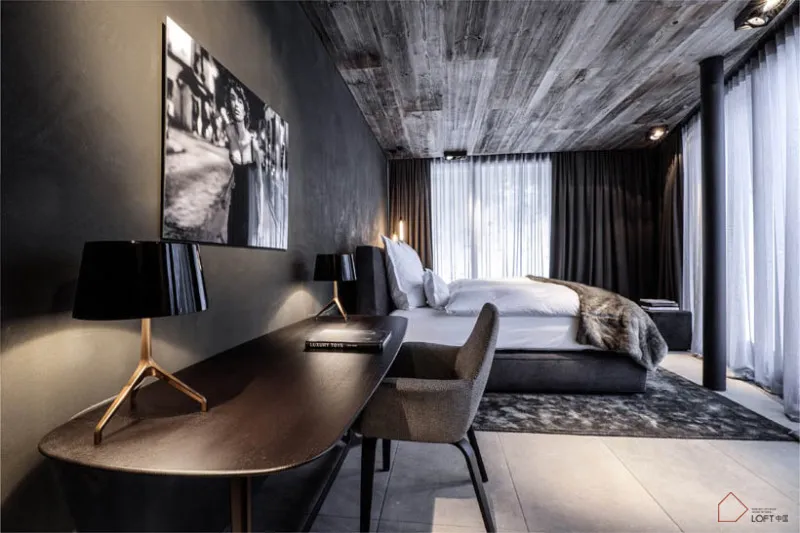 Modern industrial bedroom featuring concrete and wooden textures, with a minimalist and luxurious design.