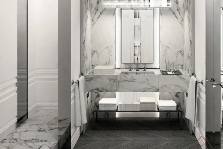 A modern bathroom interior featuring marble countertops and flooring.