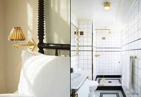 A modern bedroom and bathroom featuring white tiles, metal finishes, and a sleek, contemporary design.