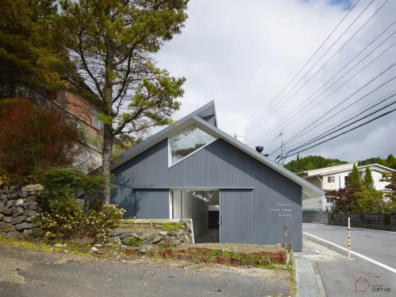 A modern house with a metal siding exterior.