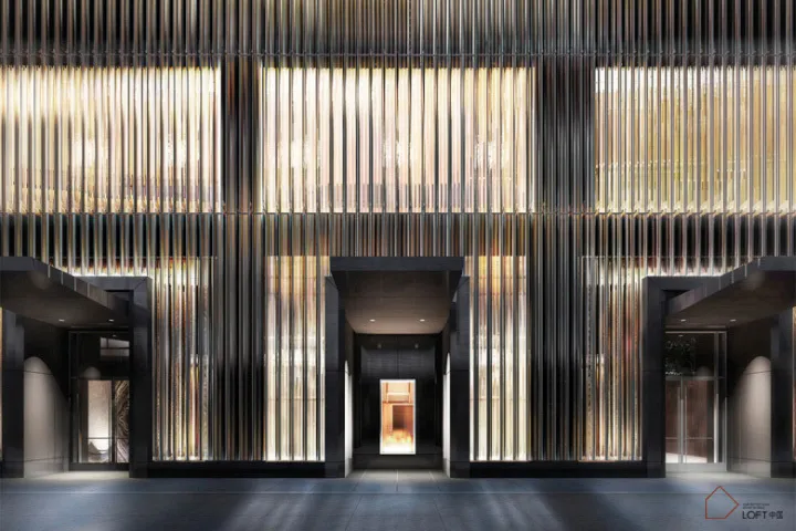 A modern lobby featuring metal walls and windows.