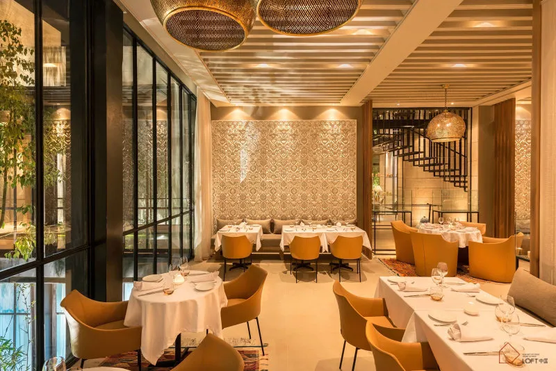 Modern interior of a restaurant featuring metal and lighting design.