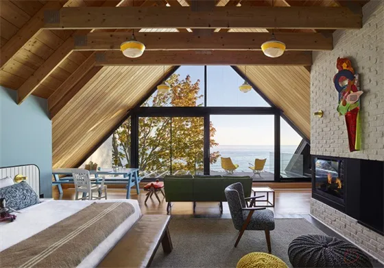Modern bedroom featuring a sea view and wood elements.