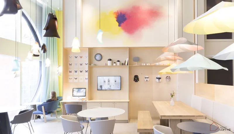 A modern, minimalist office space featuring mixed materials and sleek design elements.
