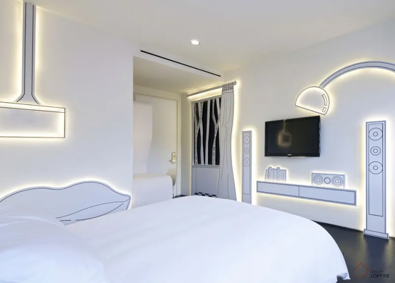 Modern minimalist white bedroom featuring well-designed lighting fixtures.