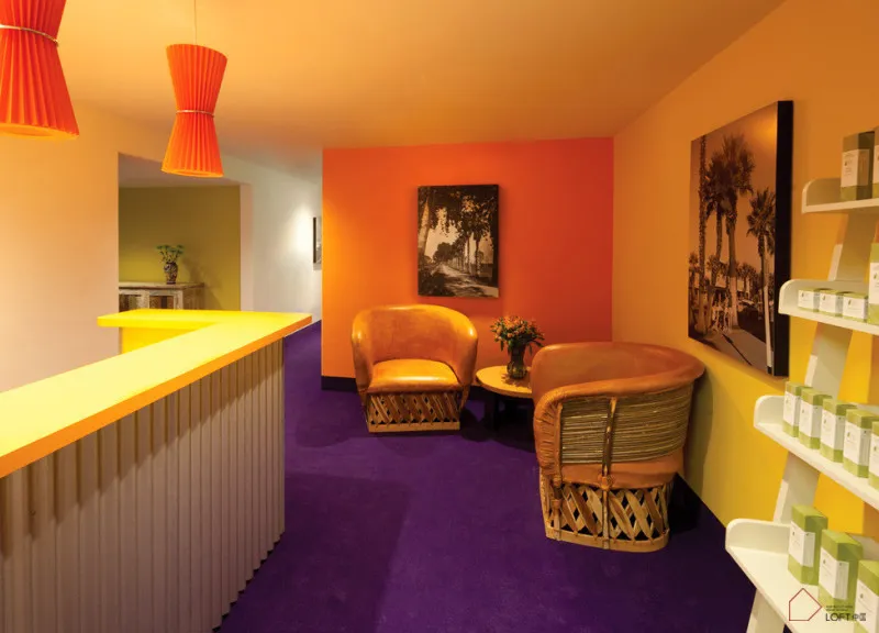 A modern interior design featuring a cafe bar with orange and purple colors, including chairs, counter, and shelves.