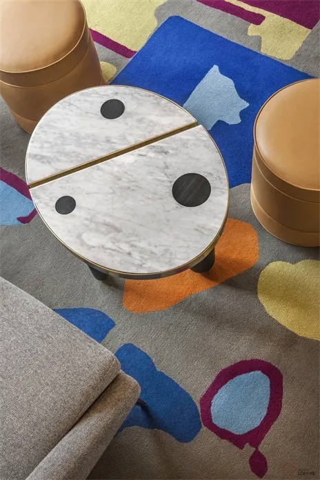 A modern industrial-style side table featuring a marble top and wooden legs.