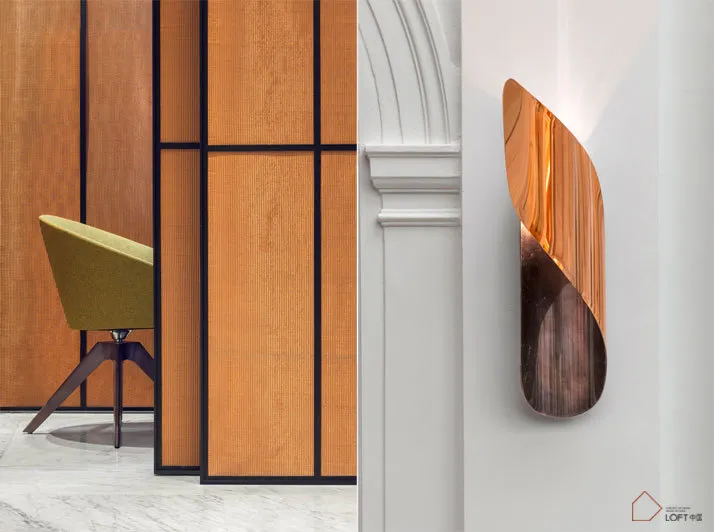A modern interior design featuring a metallic wall-hanging decor