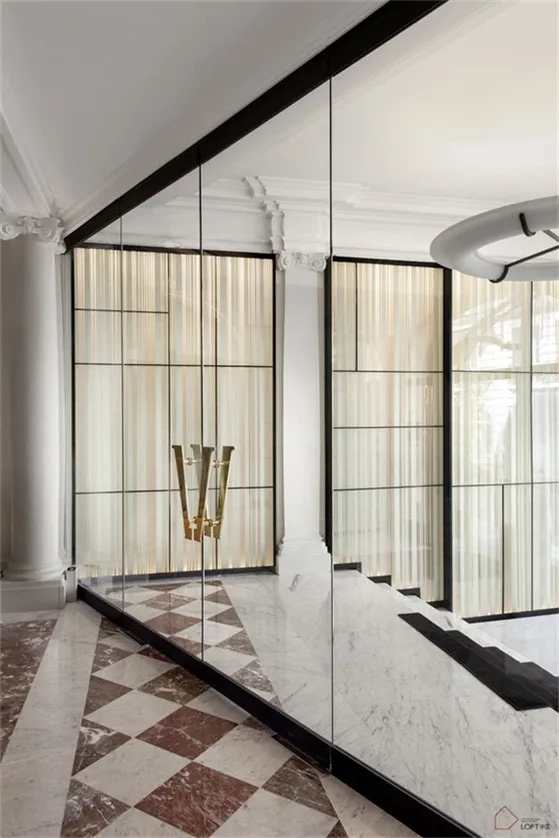 Modern interior design featuring glass walls in a contemporary space.