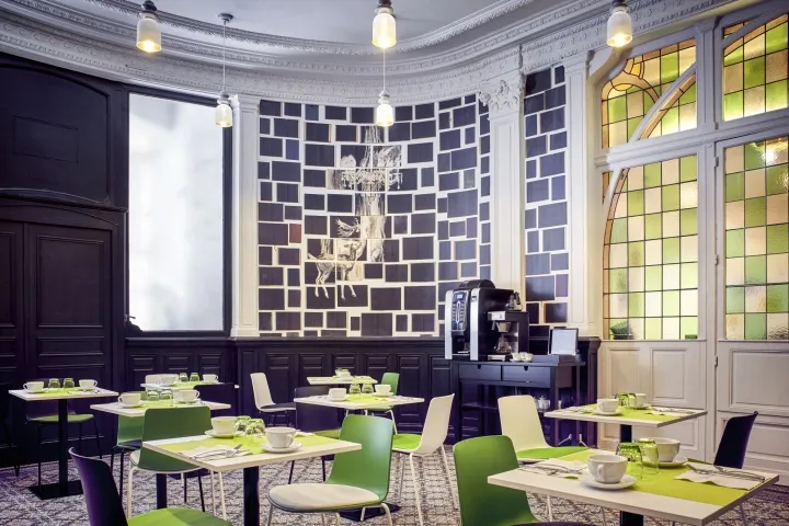 A modern restaurant interior with acrylic and green accents.