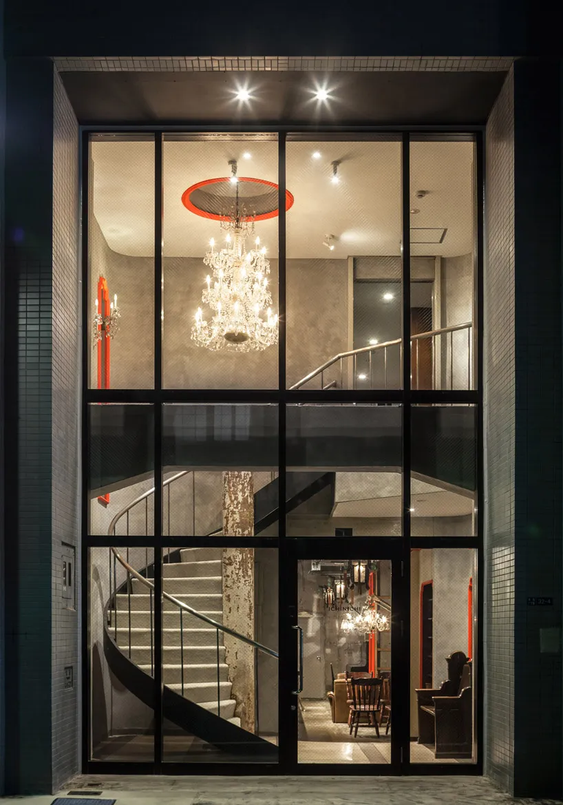 Modern industrial lobby with metallic elements and glass features.