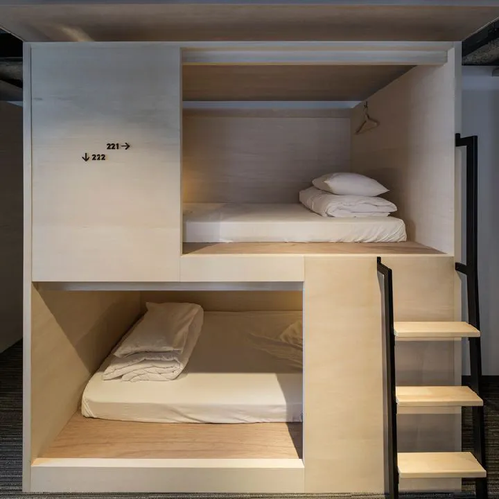 Minimalist bedroom featuring wood bunk beds