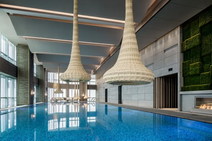 Modern interior of a swimming pool with glass and ceramic tiles
