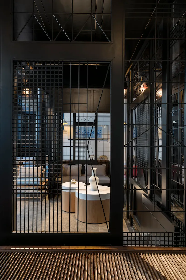 Industrial-style lobby area with concrete and glass materials.