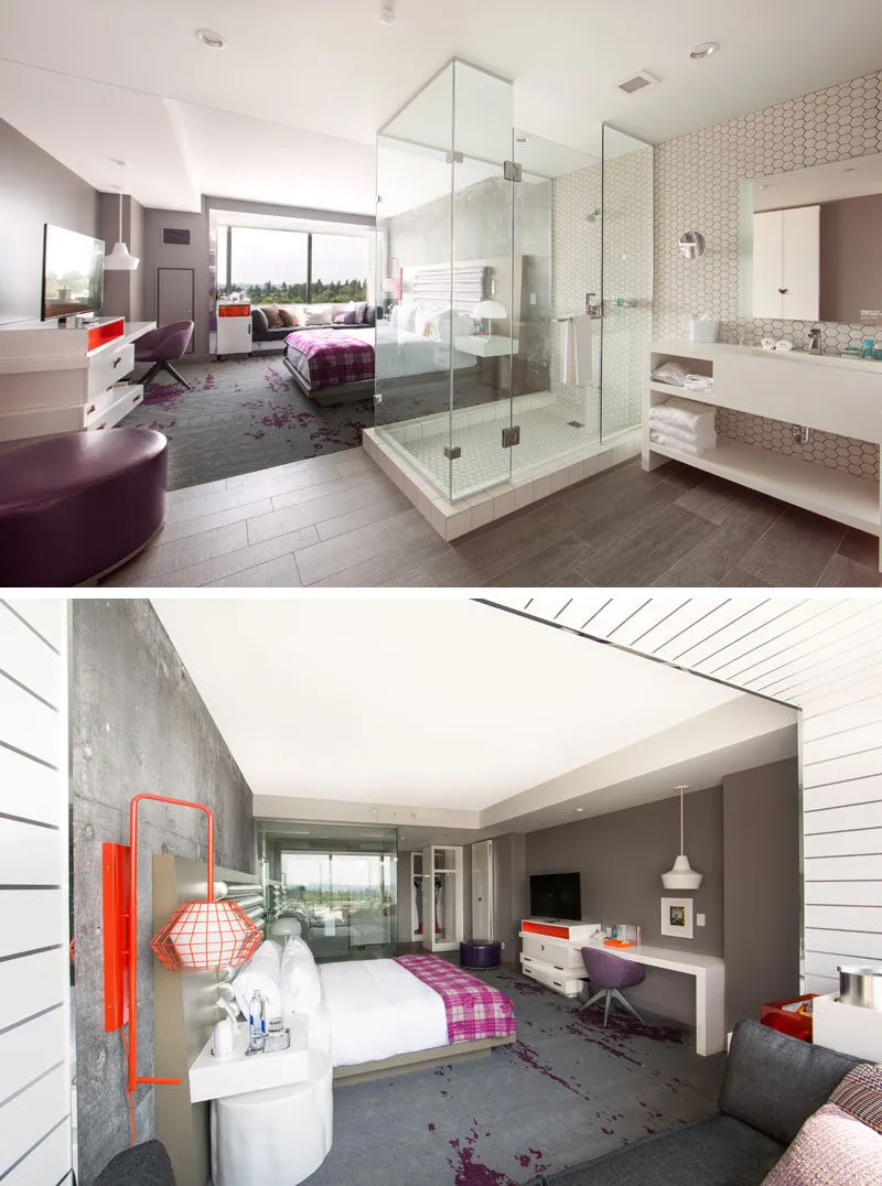A modern hotel suite featuring a glass-enclosed shower and concrete walls with a leather ottoman and hexagonal tiles